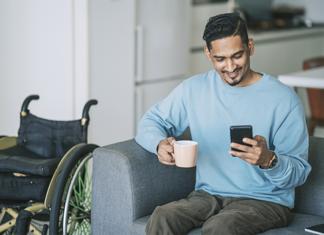 laptop on a desk with person looking at screen.